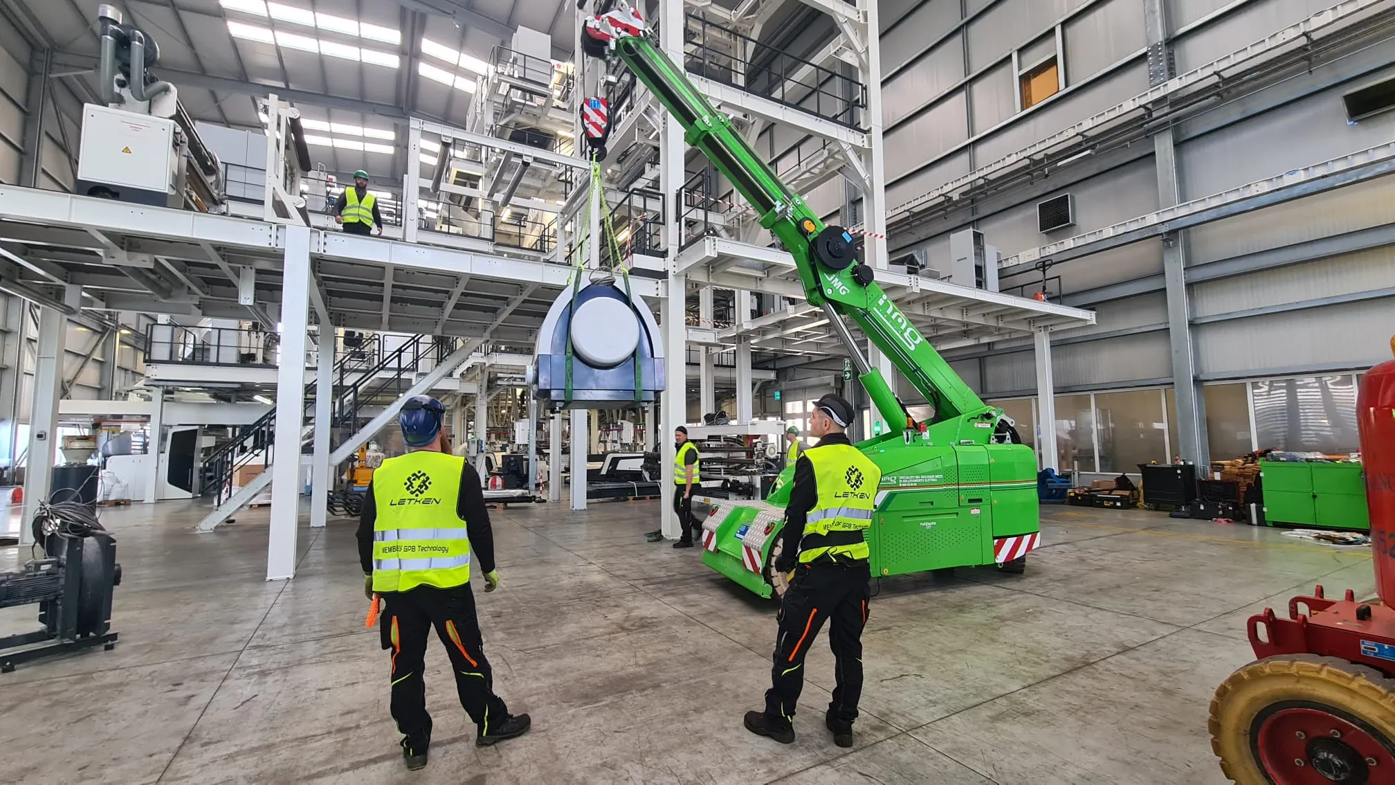 LETKEN team working on a technology installation